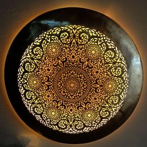 A round copper artwork for wall decoration