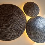 Yellow brass plates for wall decoration.